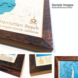 May include: A wooden frame with a rustic, distressed finish. The frame is made from reclaimed barnwood and has a natural wood color. The frame is shown with a map of Manhattan Beach, California, inside. The map is laser-cut and features a blue water color. The frame is a great way to add a touch of rustic charm to your home decor.