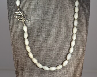 Light grey oval glass bead necklace with toggle clasp