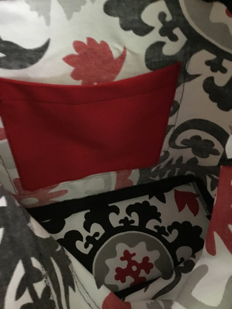 Stylish woman\u2019s all around tote bag 18 x 15 inches in red black and white with inside and outside pockets sturdy home dec fabric