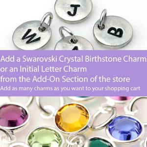 May include: A close-up of silver charms with the letters W, J, and B. The charms are for adding to jewelry. The text below the charms reads "Add a Swarovski Crystal Birthstone Charm or an Initial Letter Charm from the Add-On Section of the store. Add as many charms as you want to your shopping cart."