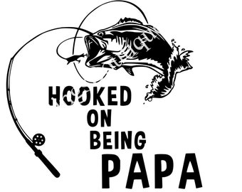 May include: Black and white illustration of a fish on a hook with the text "Hooked on being Papa".