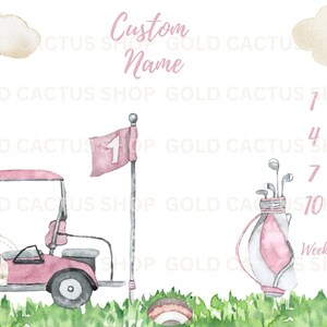 May include: A pink and white golf-themed baby growth chart with a pink golf cart, a golf bag, and a golf flag. The chart has numbers 1 through 12 for weeks and months.