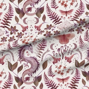 May include: A whimsical pattern featuring dragons, moths, flowers, ferns, mushrooms, and crescent moons in shades of purple, brown, and pink on a white background. The design has a fairytale or fantasy theme.