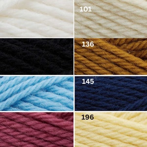 May include: A collection of yarn skeins in various colors, including white, black, brown, blue, and pink. The skeins are labeled with numbers: 100, 101, 102, 136, 141, 145, 187, and 196.