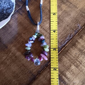 Gemstone Ring pendant, Tourmaline and Rainbow Quartz crystal on Silver with leather cord.