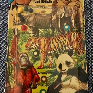 Vintage Puzzle Card. Animals at Risk.