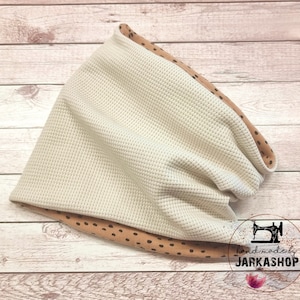 Może przedstawiać: Beżowy materiał wafelkowy z brązowymi kropkami na krawędziach. Materiał jest złożony i zwinięty w kształt rurki. Tekst "handmade by JARKASHOP" jest widoczny w prawym dolnym rogu obrazu.