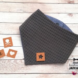May include: Gray waffle fabric baby bandana with a brown leather star patch. The bandana is handmade by Jarkashop.