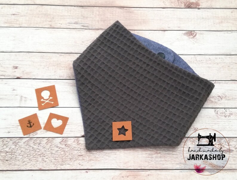 May include: Gray waffle fabric baby bandana with a brown leather star patch. The bandana is handmade by Jarkashop.