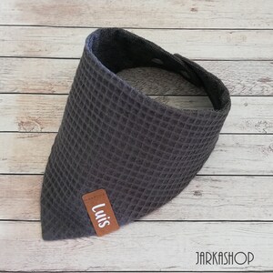 May include: Gray waffle-textured bandana with a brown leather patch that says "Luis".