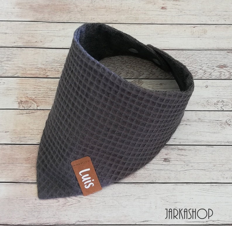 May include: Gray waffle-textured bandana with a brown leather patch that says "Luis".