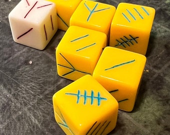 Bawwwk's Knucklebones Set of 6d6 (Yellow with Blue Etching) and 1d3 (White) with sealed bag. Far realm magic may or may not be included.