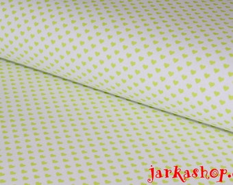 May include: White fabric with a repeating pattern of small green hearts.