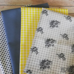 May include: Four fabric swatches, one with a white background and black hearts, one solid blue, one yellow and white gingham, and one white and grey gingham with a black floral pattern.