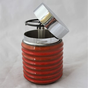 Cigarette dispenser with twist-off lid orange silver