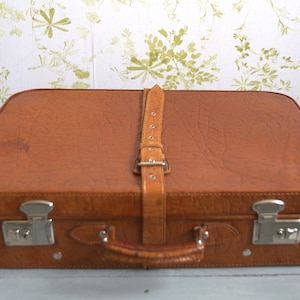 cognac-colored leather suitcase 70s