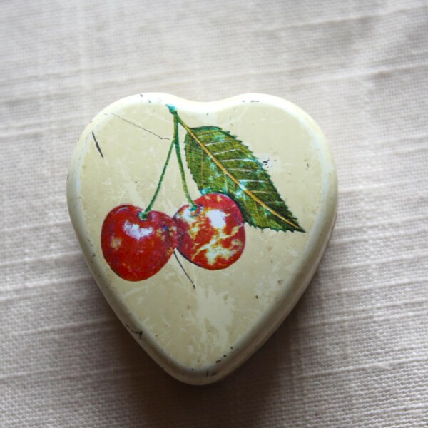 old heart-shaped tin of cherries