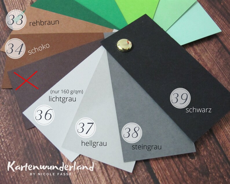 May include: A color chart with 10 different paper samples, numbered 33 through 39. The colors include green, brown, gray, black, and white. The text on the chart reads "rehbraun", "schoko", "lichtgrau", "hellgrau", "steingrau", and "schwarz".