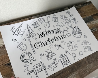 May include: Black and white line art print with the words "Merry Christmas" and various Star Wars-themed holiday illustrations. Includes a Christmas tree, Darth Vader, and the Millennium Falcon.