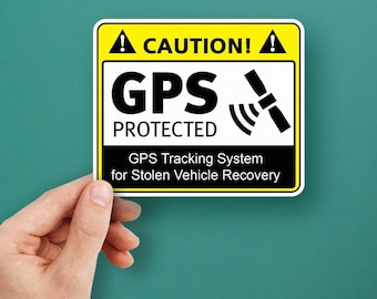 May include: A yellow and black caution sign with a GPS symbol and the text "CAUTION! GPS PROTECTED GPS Tracking System for Stolen Vehicle Recovery".