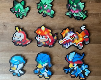 Sprigatito, Floragato, Meowscarada, Fuecoco, Crocalor, Skeledirge, Quaxly, Quaxwell, Quaquaval - Paldea, Generación 9, Escarlata y Violeta