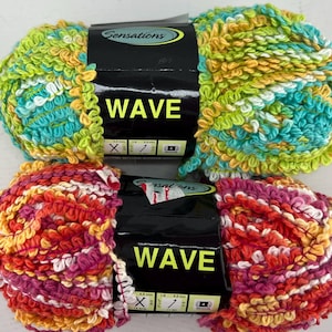 May include: Two skeins of Sensations Wave yarn. The top skein is green, yellow, and white. The bottom skein is red, orange, pink, and white.