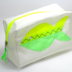 small cosmetic bag is made of upcycling canvas with a yellow/green fish