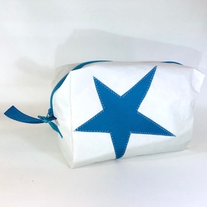 large toiletry bag is made of upcycling canvas with a turquoise star