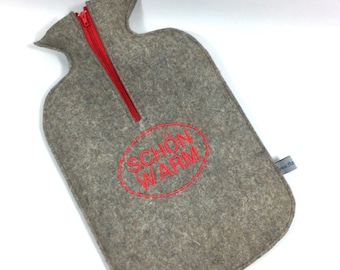 Felt cuddly hot water bottle cover in natural gray with “NICE WARM”