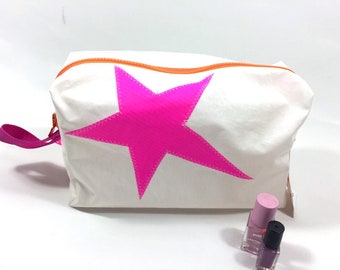 large toiletry bag is made of upcycled canvas with pink star