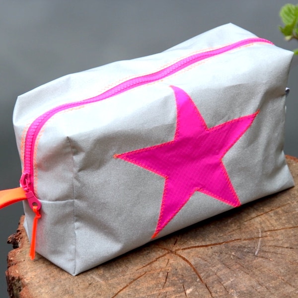 large toiletry bag is made of waterproof silver Airtex fabric with pink star