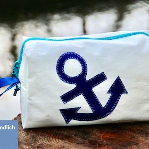 large toiletry bag is made of upcycled canvas with blue anchor