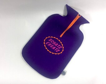 Felt cuddly hot water bottle cover in purple with “sweetheart replacement”