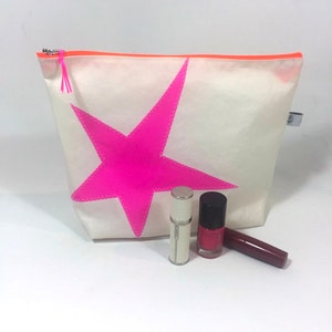 Segeltuchkosmetiktasche mit pinken Stern