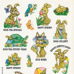 May include: A sheet of stickers featuring cute cartoon bunnies in various spring-themed scenes. The stickers include phrases like "Happy Spring!" and "Eggs-tra Special!"