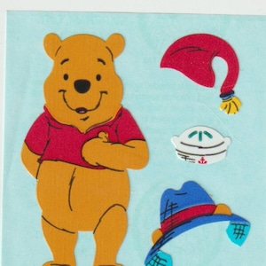 Vintage Sandylion Winnie l'ourson Strip, Habille un ours, Déguisement de vêtements - Feuille d'autocollants