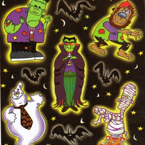 May include: A set of eight Halloween stickers featuring a variety of spooky characters, including a vampire, a werewolf, a ghost, a mummy, and Frankenstein's monster. The stickers are on a black background with yellow stars and bats.
