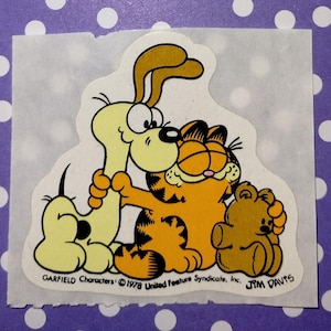 May include: A set of three ceramic mugs with a speckled, matte finish. The mugs are in shades of cream, light gray, and dark gray. Each mug has a simple, minimalist design, perfect for coffee or tea.