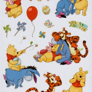 May include: A set of 25 Winnie the Pooh stickers featuring various characters from the cartoon, including Winnie the Pooh, Piglet, Tigger, and Eeyore. The stickers are colorful and feature a variety of poses and expressions.