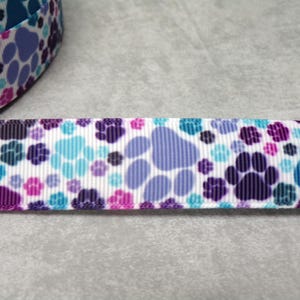 2,40 Euro/m  Pfote bunt blau lila töne 22 mm   Borte Ripsband Pfoten