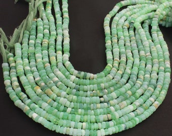 May include: A strand of green opal beads, each bead is faceted and has a slightly different shade of green. The beads are strung on a thin thread and are ready to be used for jewelry making.