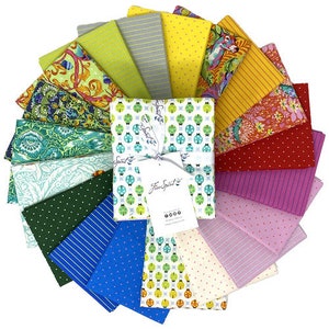 May include: A collection of 18 fabric squares featuring a variety of patterns and colors, including green, yellow, red, blue, and white. The fabric squares are arranged in a circle, with a larger square in the center featuring a repeating pattern of ladybugs. The text "Free Spirit" is printed on the center square.
