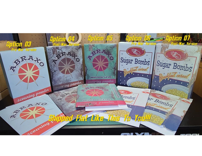 May include: A collection of vintage-style boxes featuring different designs. The boxes are labeled with the words "Abraxo scouring powder", "Sugar Bombs breakfast cereal", and "Abraxo industrial grade scouring powder". The boxes are in various shades of blue, red, and yellow, with a distressed, aged look.