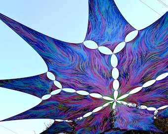 May include: A large, colorful canopy with a swirling, psychedelic pattern in shades of blue, purple, green, and pink. The canopy has multiple circular cutouts, creating a unique and whimsical design.