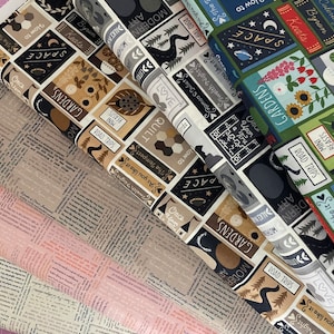 May include: Four fabric swatches with a repeating pattern of colourful squares featuring words and illustrations. The words include "Gardens", "Road Trips", "Space", "Love", "Art", "Modern", "Quilt", "Once Upon a Time", "The Tempest", "As You Like It", "Twelfth Night", "Romeo and Juliet", "House Plants", "Coleridge", "Byron", "Keats", "Beast", "Mini", "Great Train Journey", "Pond Life", and "How To".