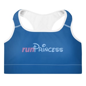 May include: A blue sports bra with a white racerback and a pink and blue graphic that says "run princess" with a Disney-style castle logo.