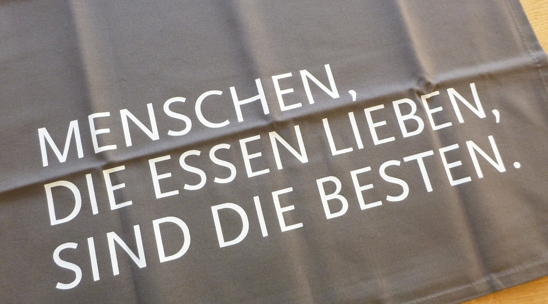 Geschirrtuch mit Spruch grau weiß Menschen, die Essen lieben, sind die