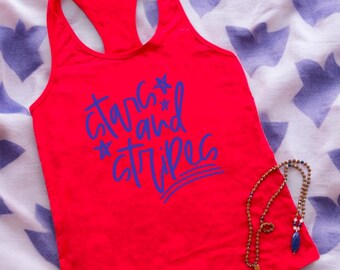 May include: Red tank top with a blue graphic that says "stars and stripes".