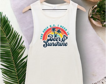 May include: White sleeveless tank top with a rainbow graphic and the text "The only B.S. I need is Beer & Sunshine".