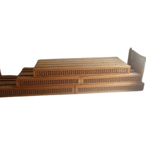 May include: A wooden bed frame with a slatted headboard and footboard. The frame is made of natural wood and has a simple, elegant design.